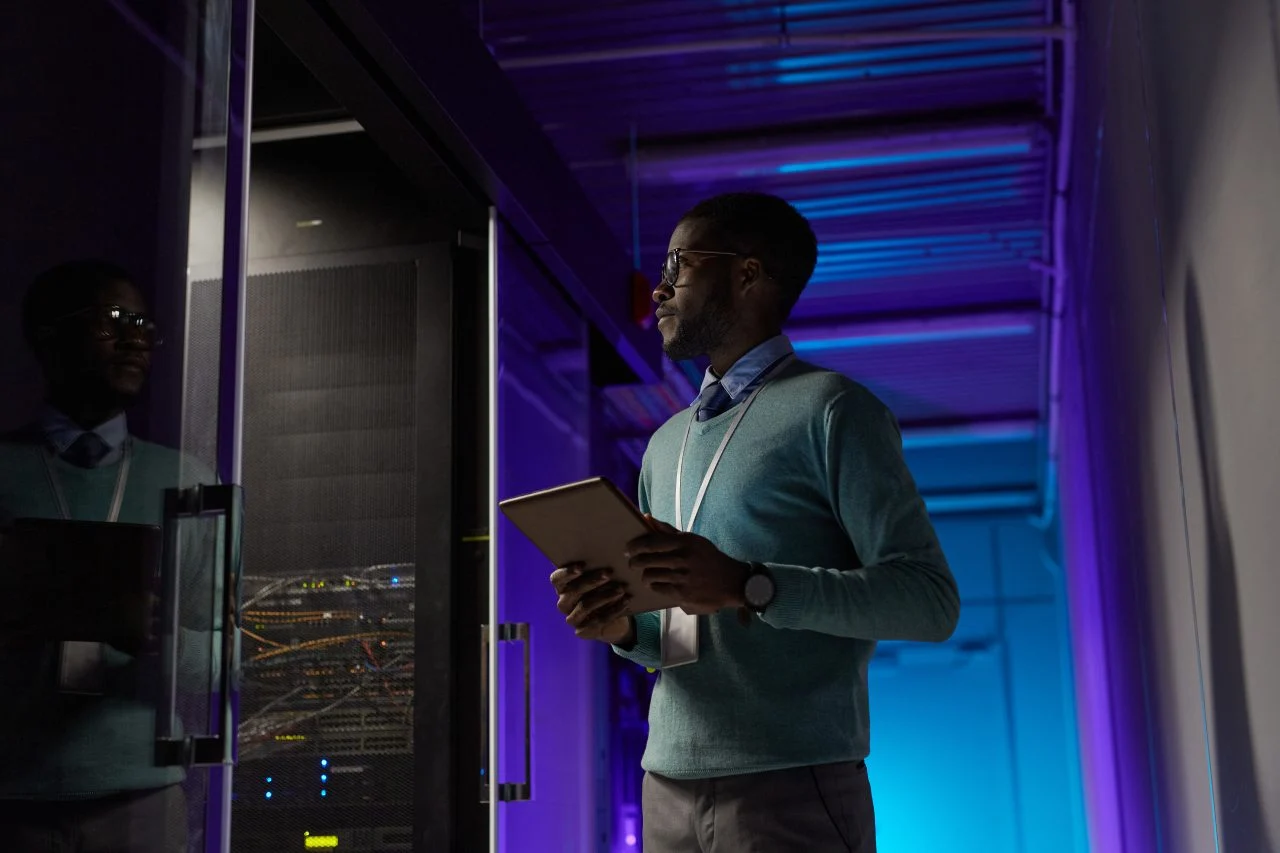 Micro Innovation technician working in a server room